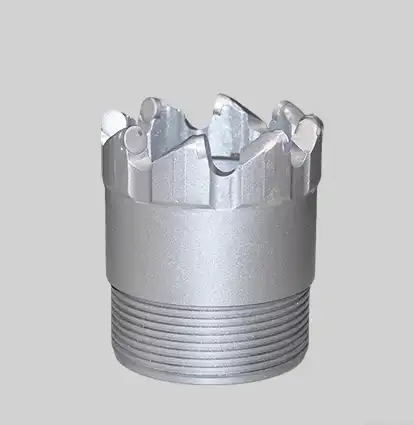 What materials compose a PDC core drill bit?